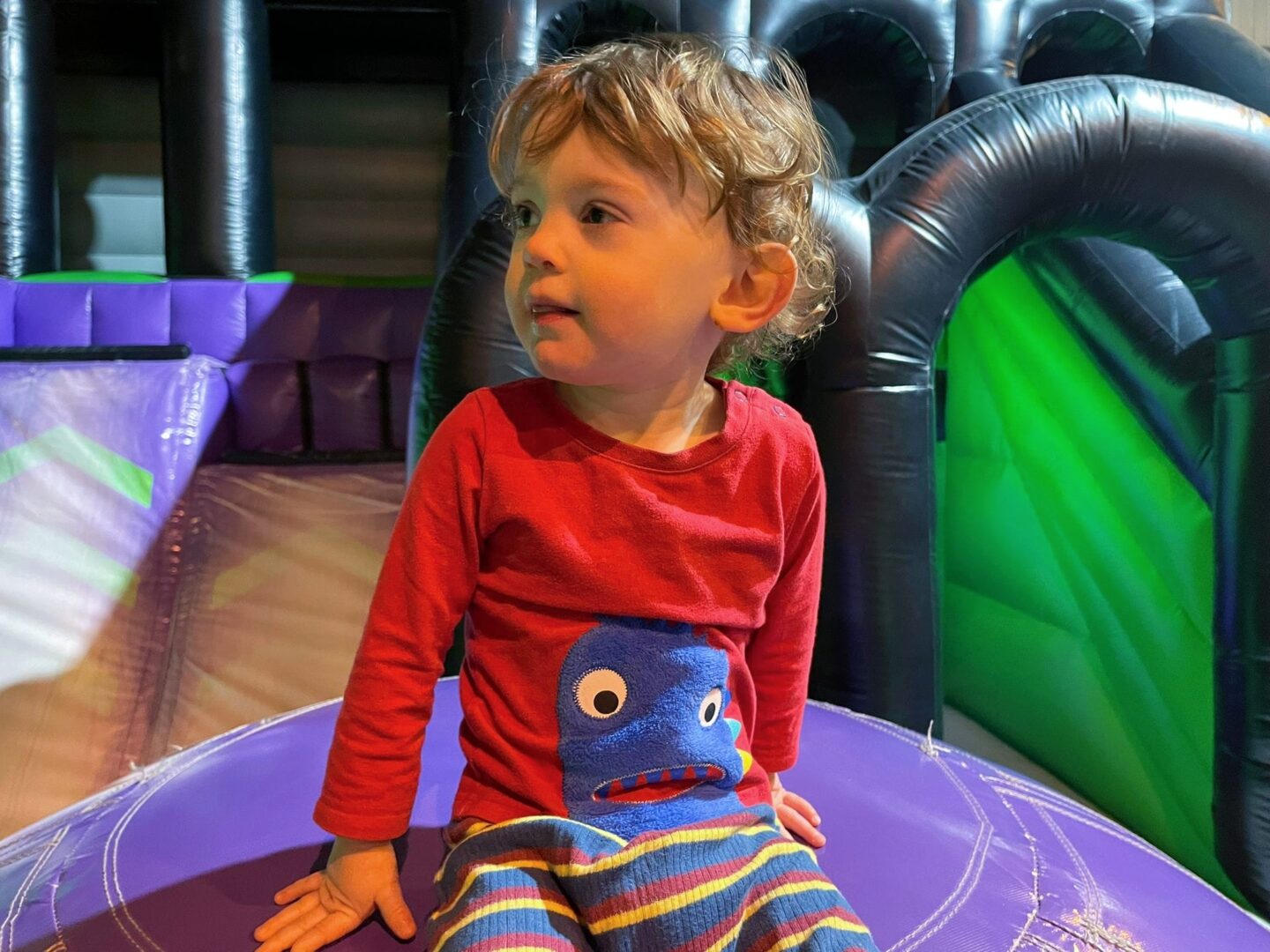 Burning energy by trampolining with a toddler at Jump Inc Bicester - inflatable course